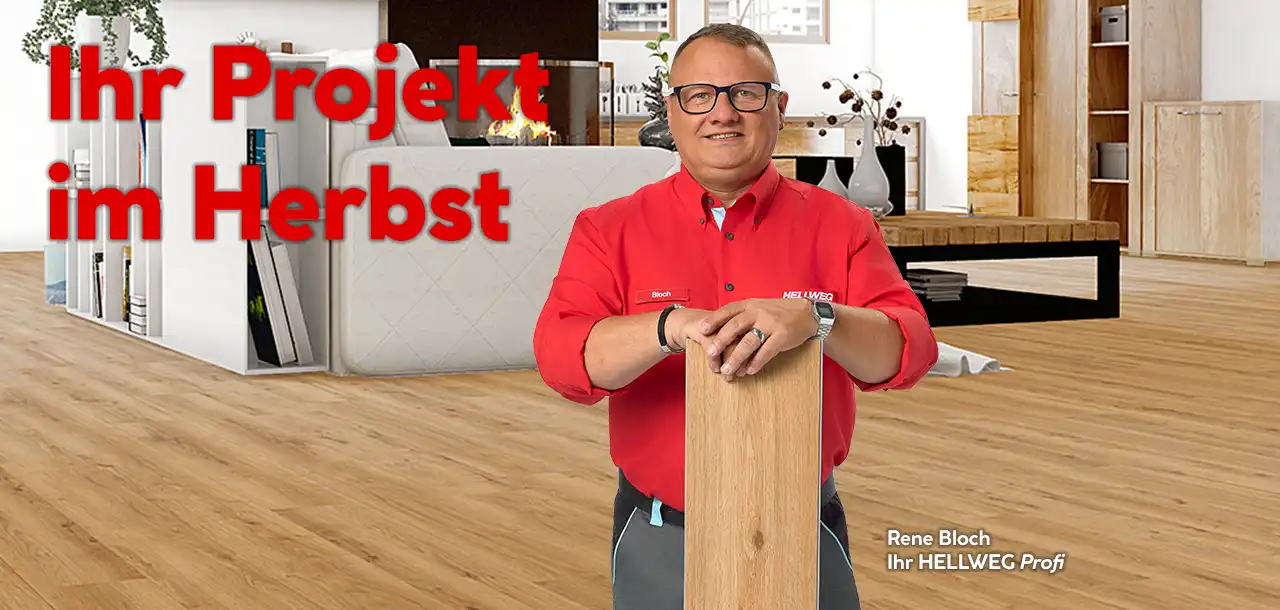 Ein männlicher Hellweg Profi mit Bodenbelag in der Hand 